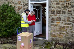 Elderly-Lady-Answering-Door